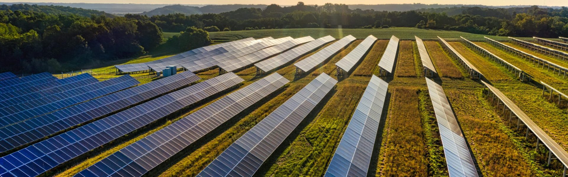 Aerial view of a solar farm in Red Wing, MN, with solar panels harnessing the sun's energy.